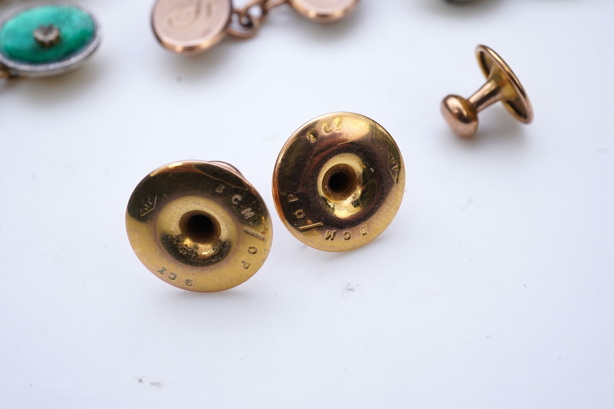 A collection of cufflinks and dress studs